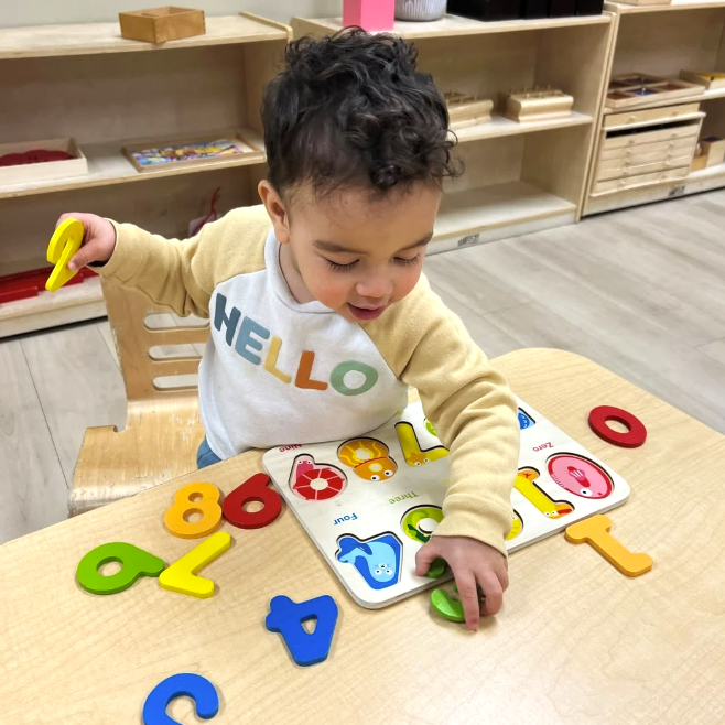 toddler playing with numbers
