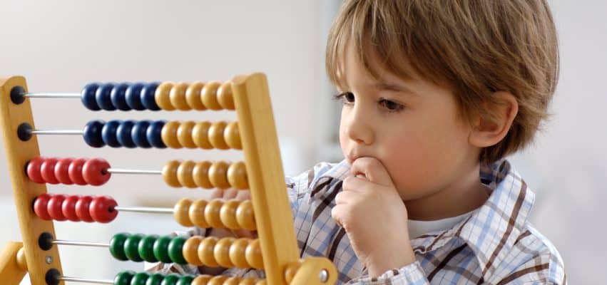 Toddler engaging in hands-on Montessori activities at Villa Montessori